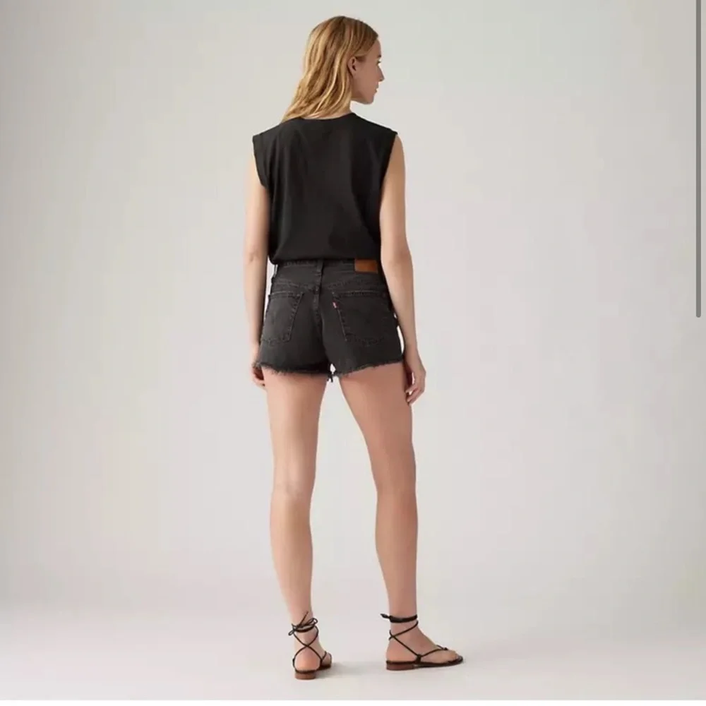 Levi’s NWT black 501 original fit high rise distressed black denim jean shorts